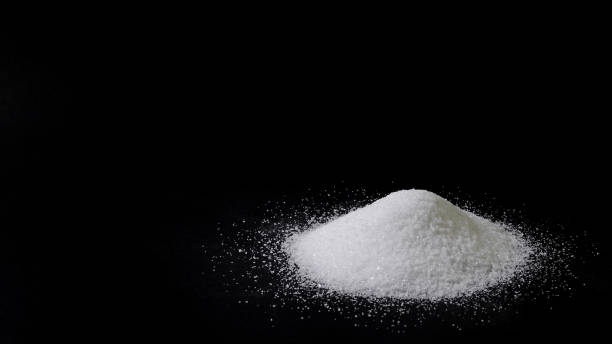 istock A pile of sugar on a black background. 1065028528
