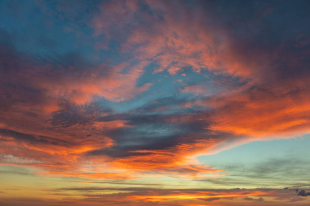 istock Dramatic colored sky at sunset. Moon and star in the clouds. 1065043134