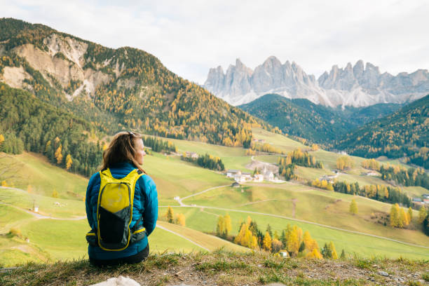 Female hiker looks at view