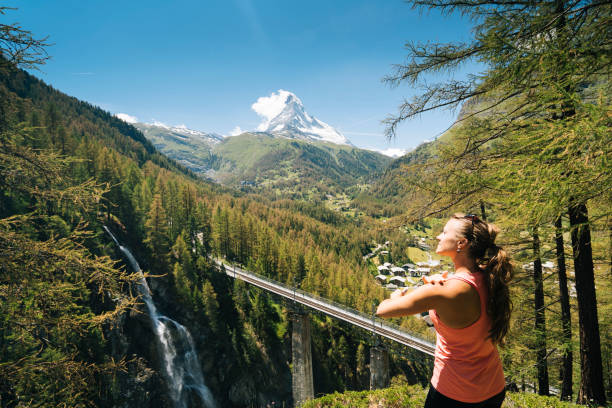 istock Young female hiker applies sunscreen 1065044000