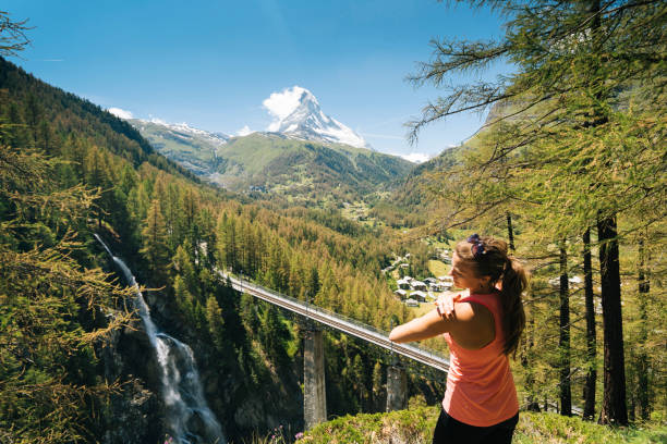 istock Young female hiker applies sunscreen 1065045596
