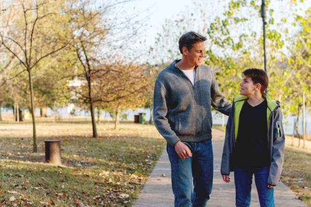 istock Walking through the park with my father 1065047408