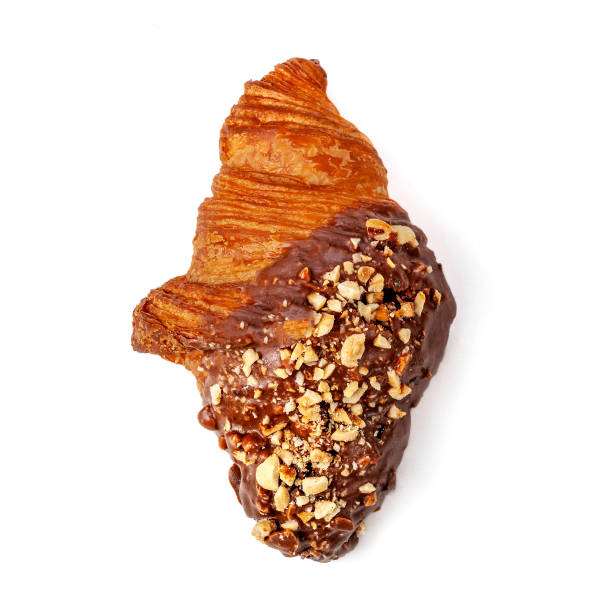 istock Fresh Croissant with chocolate and nuts isolated on white background, close up. View from above 1065049506