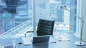 High Angle Shot of a Working Desk of an Successful Person in Office with Cityscape Window View.