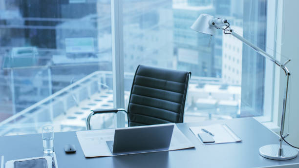 High Angle Shot of a Working Desk of an Successful Person in Office with Cityscape Window View. High Angle Shot of a Working Desk of an Successful Person in Office with Cityscape Window View. ceo stock pictures, royalty-free photos & images