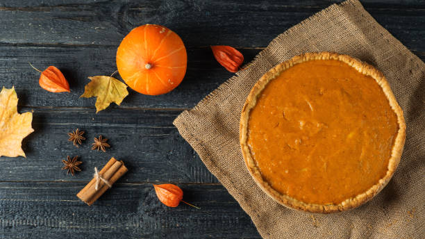 istock Pumpkin pie on a wooden table 1065050406
