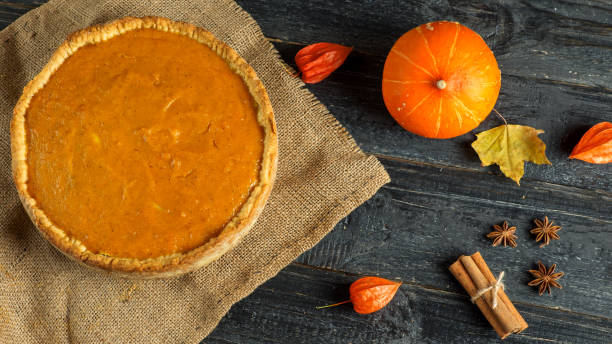 istock Pumpkin pie on a wooden table 1065050420
