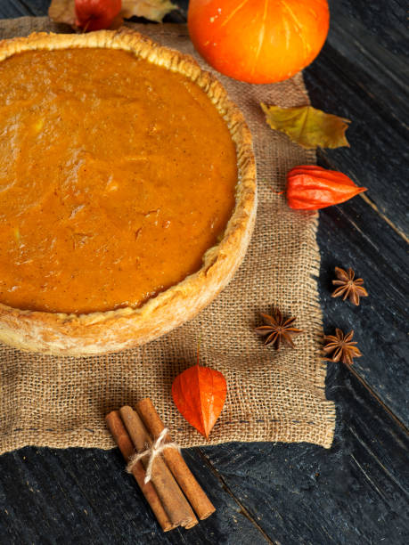 istock Pumpkin pie on a wooden table 1065050552