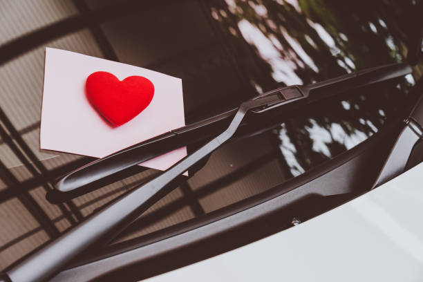 istock love letter heart on a sticky note under a windshield .vintage  color style 1065054538