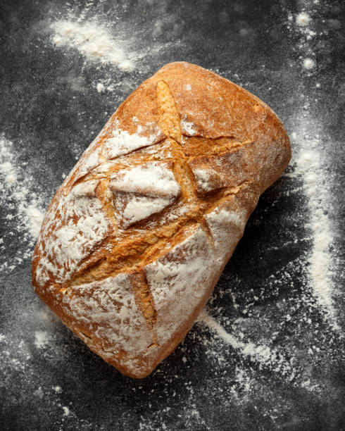 istock freshly baked sourdough bread on black background 1065060356