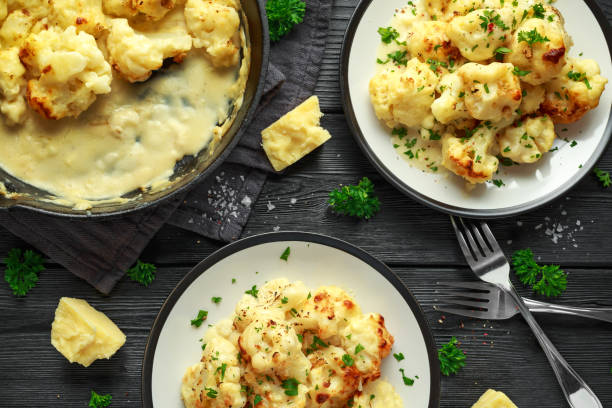 istock Roasted cauliflower with cheddar cheese sauce and herbs. 1065061762