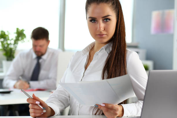 istock Beautiful smiling girl at workplace look in camera 1065063494