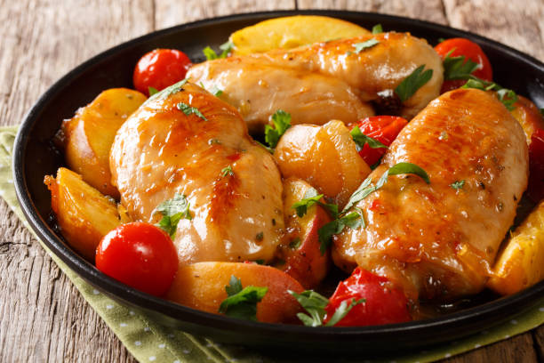 istock baked chicken breast with peaches, tomatoes, onions closeup on a plate. horizontal 1065064534