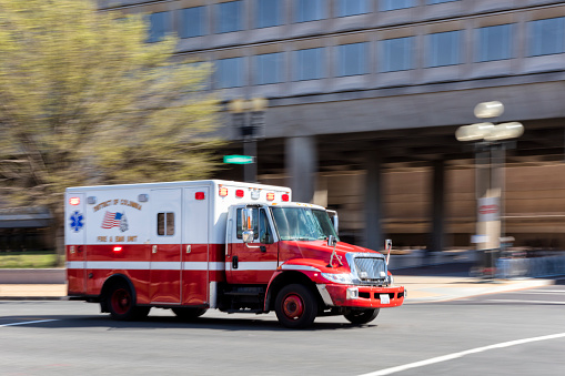 Emergency Ambulance speeding towards hospital in Washington, blurred motion, District of Columbia, USA