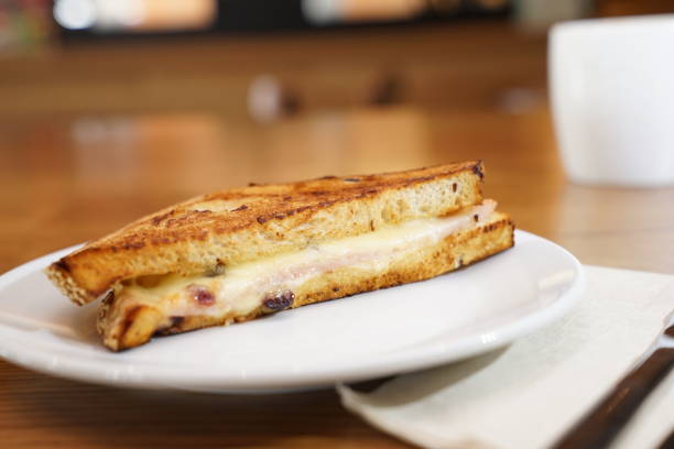 istock Whold wheat sandwich club breakfast and blur coffee cup behind . 1065070230