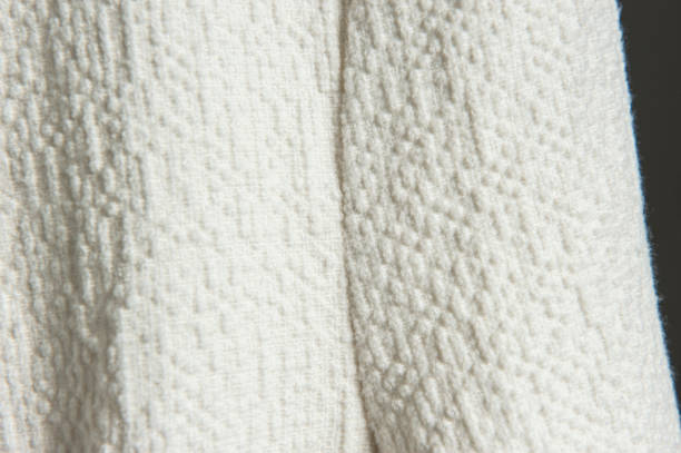 istock White coat fabric detail close-up 1065074598