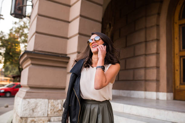 istock Young business woman talking on mobile phone 1065082928