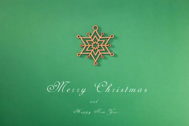 Greeting card with a Merry Christmas tree and snow, a symbol of the holiday, family togetherness. Happy New Year.