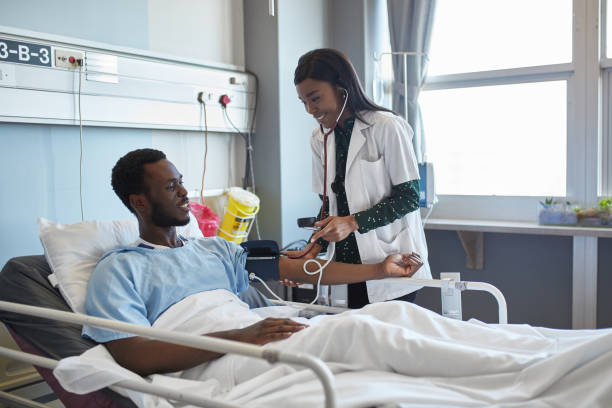 istock Medical student examining patient in hospital 1065083210