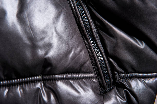 istock Partial close-up view of dark down jacket zipper 1065083320