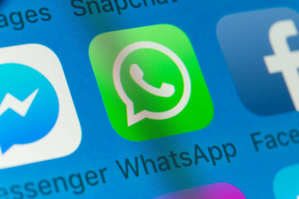 WhatsApp, Facebook, Messenger and other cellphone Apps on iPhone screen London, UK - August 01, 2018: The buttons of WhatsApp, Facebook, Messenger, Snapchat and Messages on the screen of an iPhone. brand name online messaging platform stock pictures, royalty-free photos & images