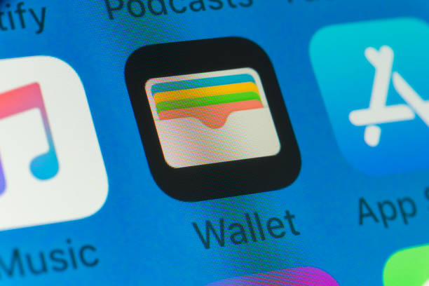 Wallet, App Store, Music and other cellphone Apps on iPhone screen stock photo