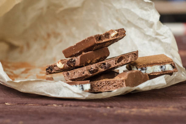 Dark chocolate bark with mixed fillingson wax paper