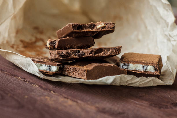 istock Dark chocolate bark with mixed fillingson wax paper 1065095620