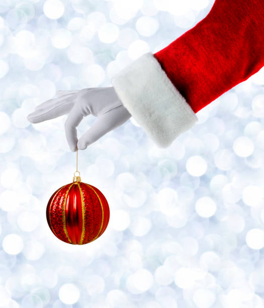 istock Santa Claus Holding Red Christmas Ornament 1065101318