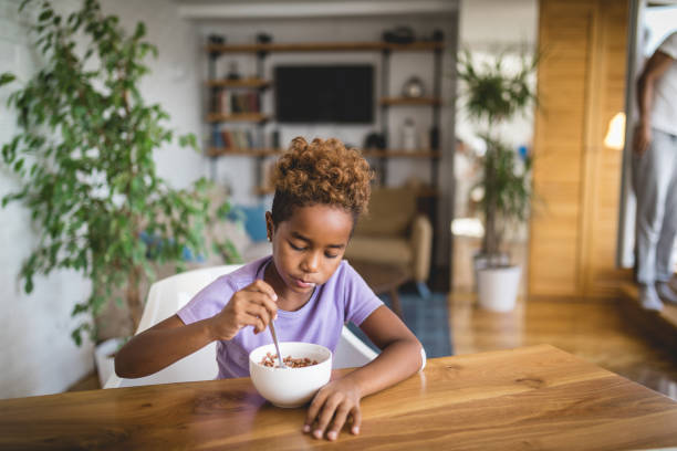 istock Lovely child eating breakfast in the morning 1065103050