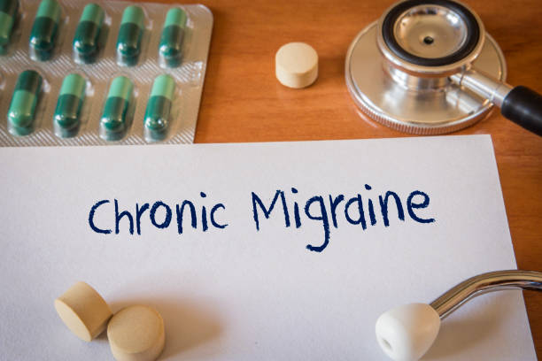 istock Stethoscope on notebook and pencil with Chronic Migraine words as 1065109966