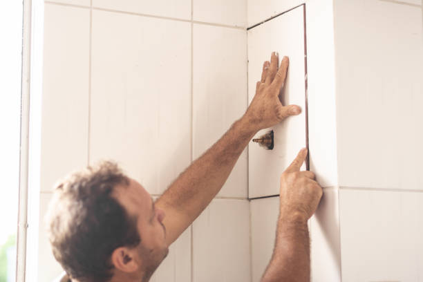 istock Plumber mason at work indoors, changing a broken water faucet 1065112218