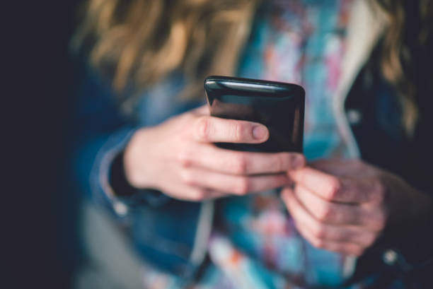 istock Girl texting on the phone 1065112490