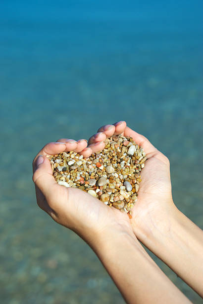 istock Heart symbol in feminine hand. 106511466