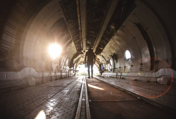 istock Stuntman standing in a abandoned airplane 1065118536