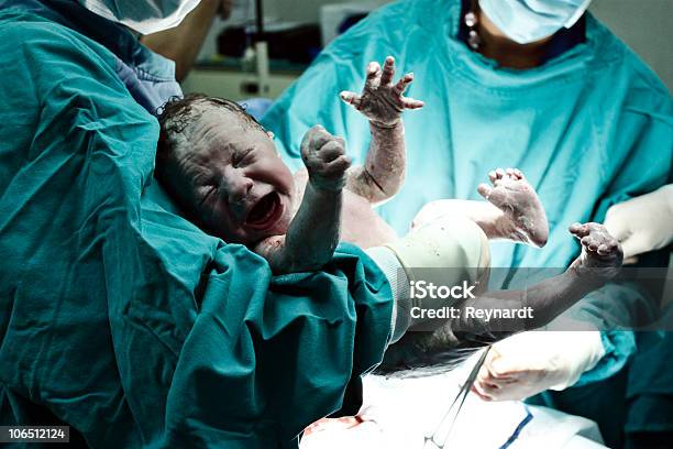 Doctor Holding New Born Stock Photo - Download Image Now - Childbirth, Labor - Childbirth, New Life