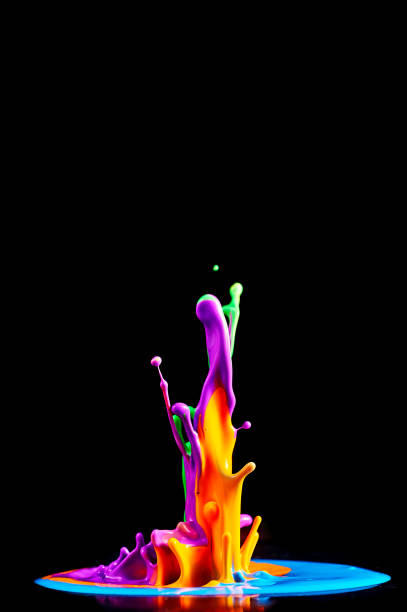 Dancing colored paint. Abstract sculpture dye. Splash of ink on a black background