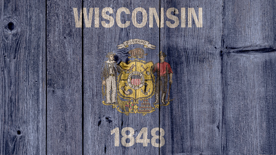 USA Politics News Concept: US State Wisconsin Flag Wooden Fence