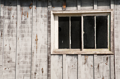 Croatia, May 01,2022 : Rustic style aged window at rural home wall.