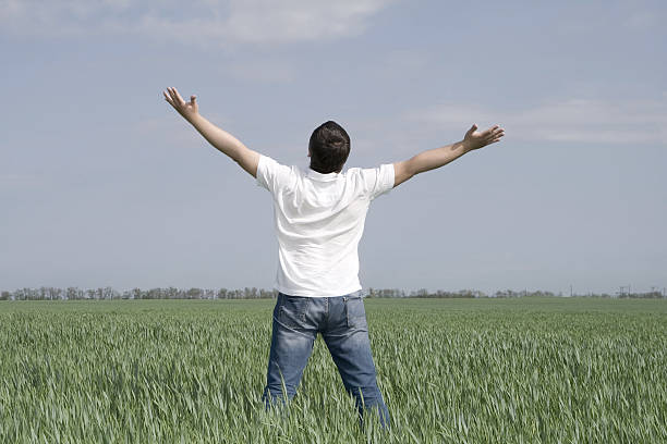 istock man take energy from nature in the meadow 106513138