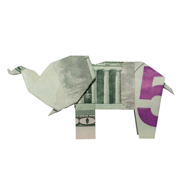 istock Money Origami ELEPHANT Left Side Folded with Real FIVE Dollar Bill Isolated on White Background 1065134172
