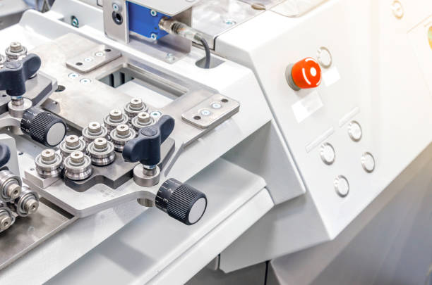 istock Metal guide rollers on industrial equipment for the production of electrical cables. Cable cutting machine. 1065134548