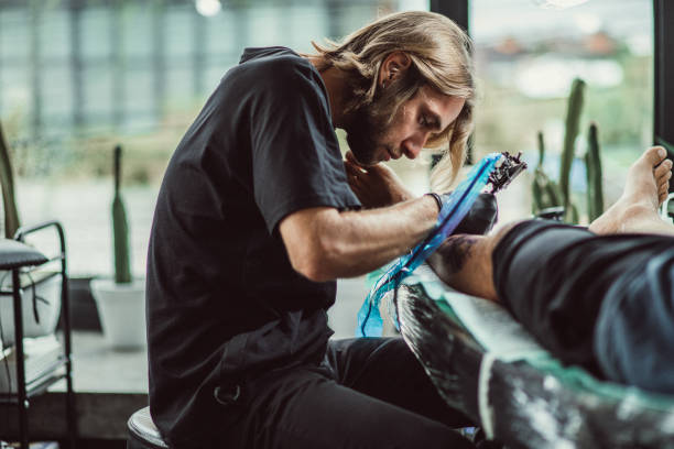 istock Artist tattooing a man 1065138758