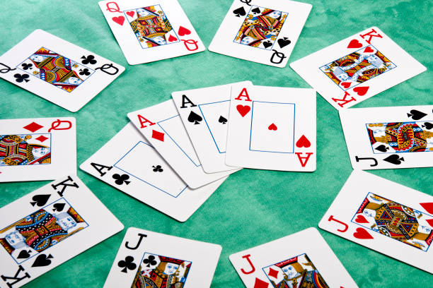 istock face cards spread on a green cloth table 1065139124