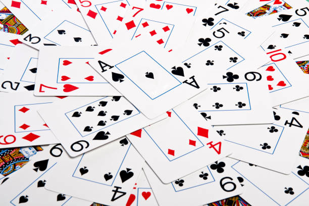 istock bunch cards spread on a green cloth table 1065139146