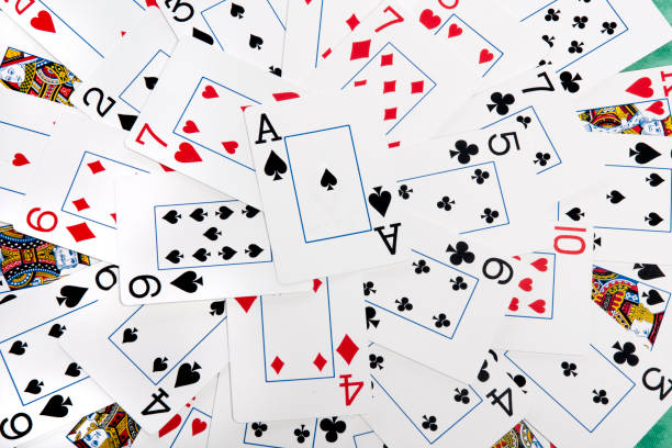 istock bunch cards spread on a green cloth table 1065139180