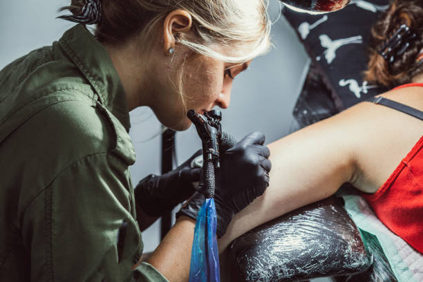 istock Woman getting a new tattoo 1065139484