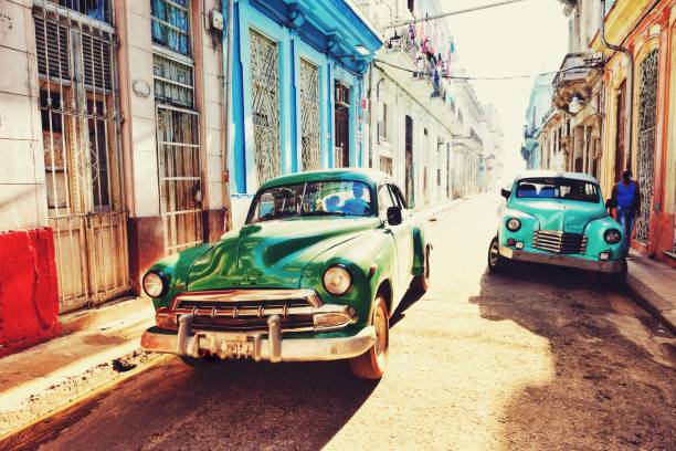 old havana street with classical cars old havana street with classical cars old havana stock pictures, royalty-free photos & images