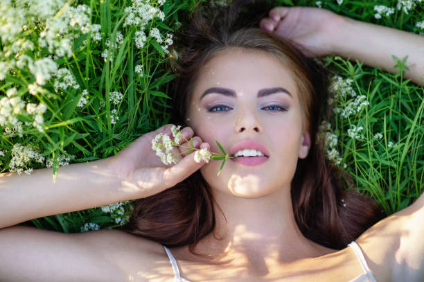 istock Beautiful girl is on nature on green grass. 1065143134