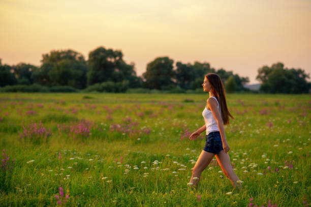 istock Young woman is walking on nature 1065143152